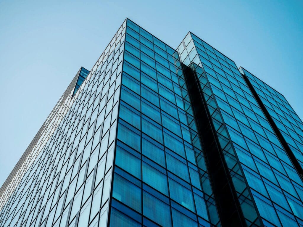 Looking upward at a large commercial city building for street commercial real estate inspection